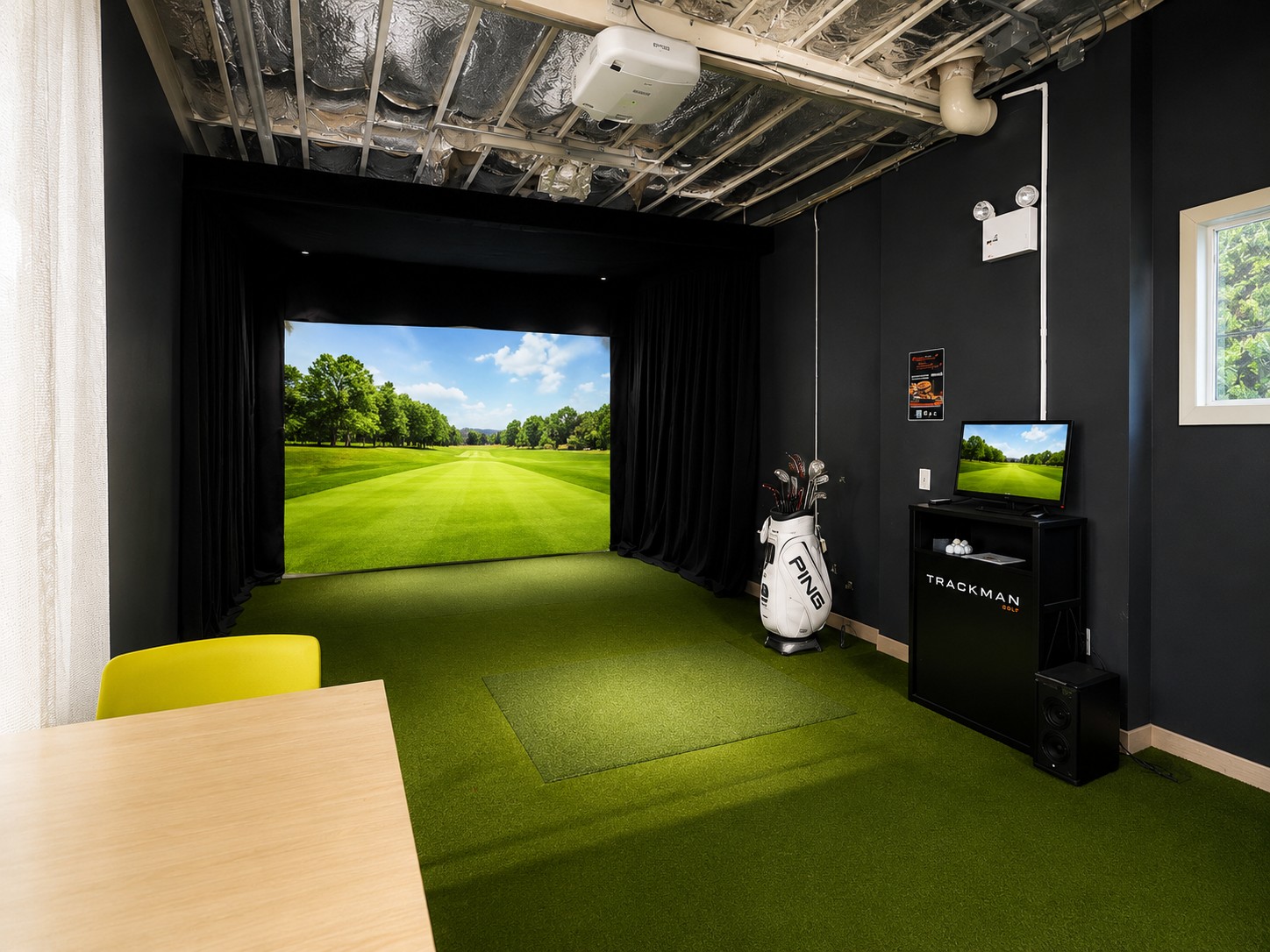 TrackMan indoor golf simulator bay